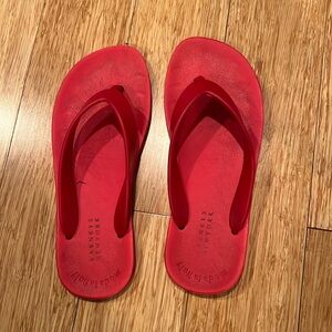 Barney’s New York flip flops